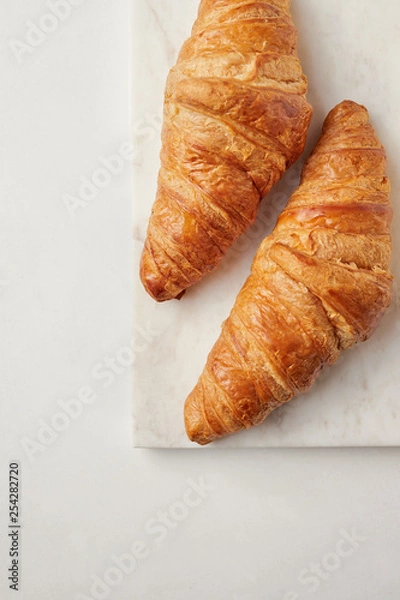 Obraz Croissants on the white marble board