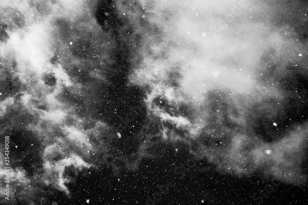 Fototapeta snowing sky with light clouds in black and white