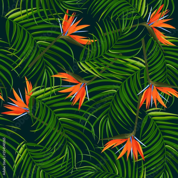 Fototapeta Dark tropical background. Palm leaves and bird of paradise strelitzia seamless pattern.