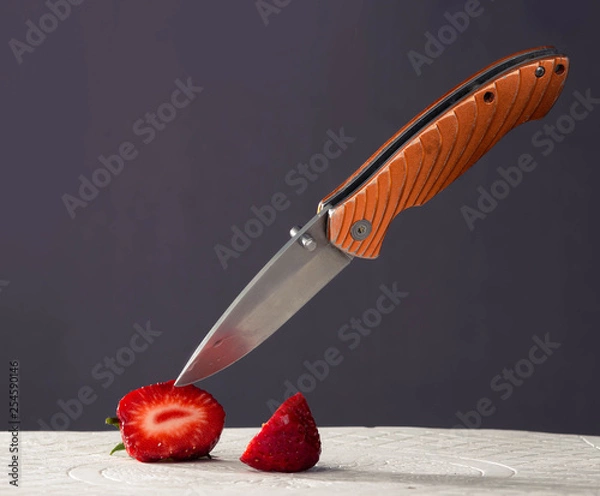 Fototapeta knife slicing fruit