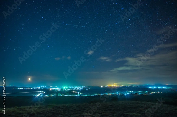 Fototapeta Night village on a background of stars