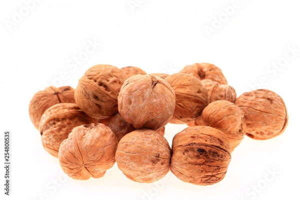 Fototapeta Walnuts on a white background