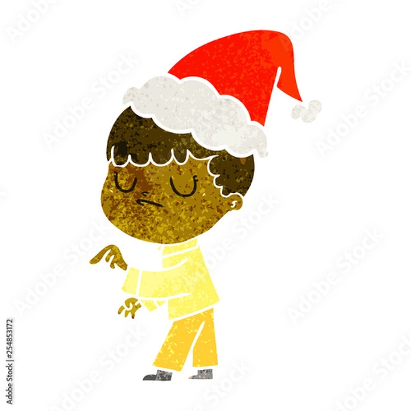 Fototapeta retro cartoon of a grumpy boy wearing santa hat
