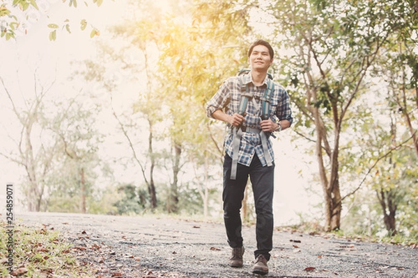 Obraz Hiking man traveling with backpack in mountains