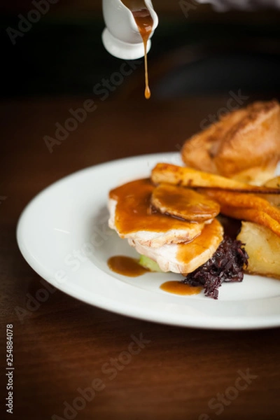 Obraz Pouring gravy on roast dinner