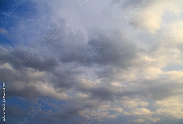 Fototapeta Clouds after rain before sunset as a background
