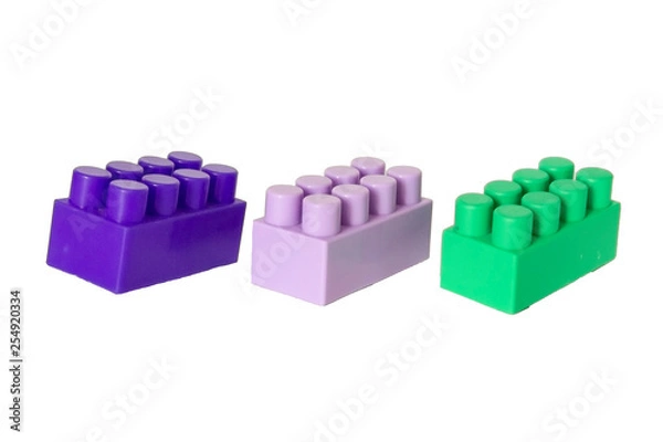 Fototapeta details of a children's plastic constructor on a white background. colored cubes. block.