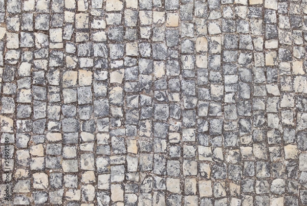 Obraz Abstract background of old cobblestone pavement close-up.