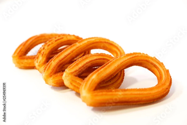 Fototapeta spanish fritters on white background