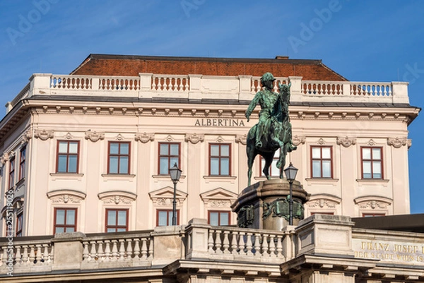 Fototapeta Austria, Vienna, Albrechtsplatz: Front view of world famous Albertina museum palais palace with Albrecht statue in the city center of the Austrian capital with blue sky - concept travel history art