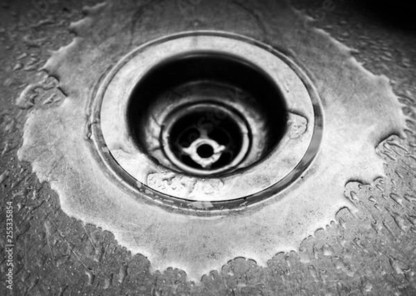 Obraz Close up of sink drain with water droplets