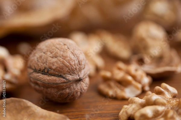 Obraz Walnuts on wooden background