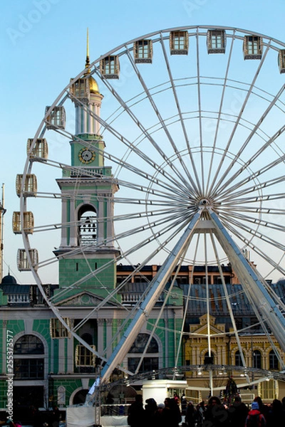 Obraz Ferris wheel. Kiev (Podol). The bell tower in the background