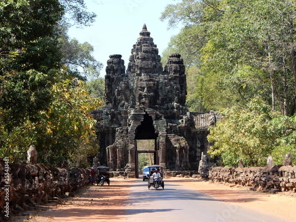 Fototapeta Beautiful view of the Victory Gate of Angkor Thom and a rickshaw with tourists
