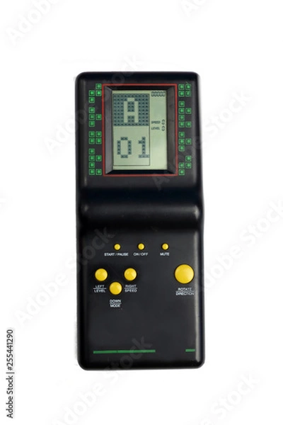 Fototapeta Black tetris game console isolated on white retro 80s and 90s style with yellow buttons game from childhood