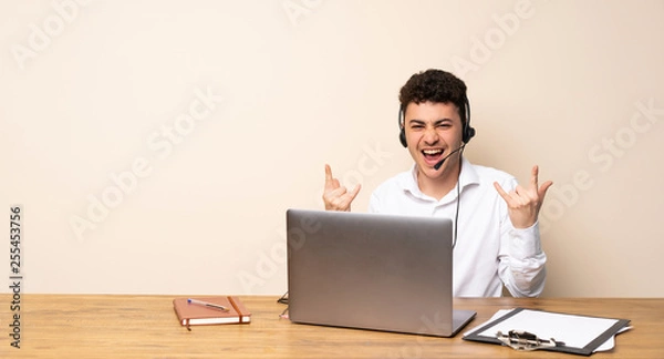 Obraz Telemarketer man making rock gesture