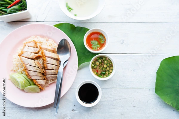 Fototapeta Hainanese rice with crispy pork , Thai gourmet steamed crispy pork rice