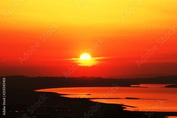 Fototapeta A spectacle of the rising sun from the direction of Enoshima , Kanagawa Japan.