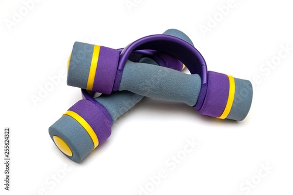 Fototapeta two soft dumbbells for children lie on a white background