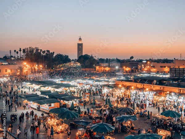 Fototapeta Djemaa el Fna - a famous market place in Marrakech, Morocco while sunset