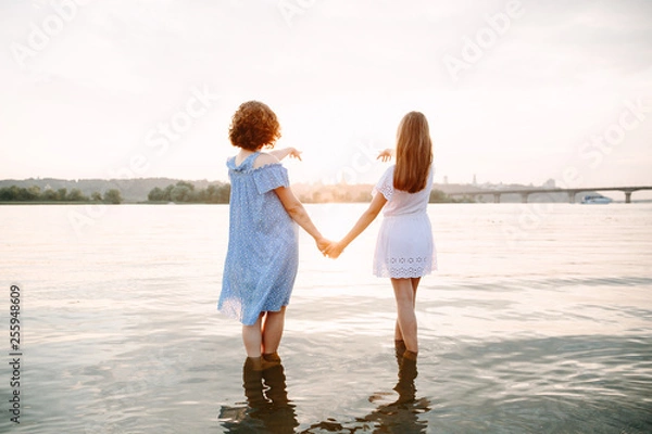 Fototapeta mother and daughter on the beach
