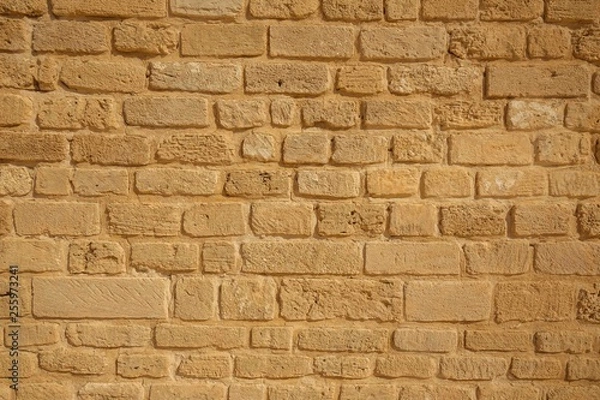Obraz Brick yellow wall background. Old stone wall background.