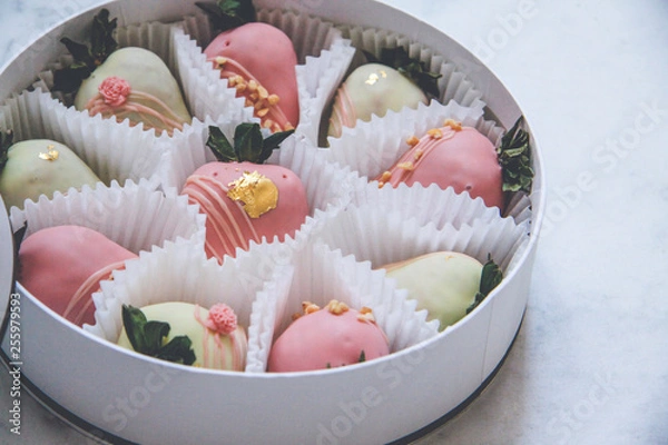 Obraz Gourmet chocolate covered strawberries in a round gift box