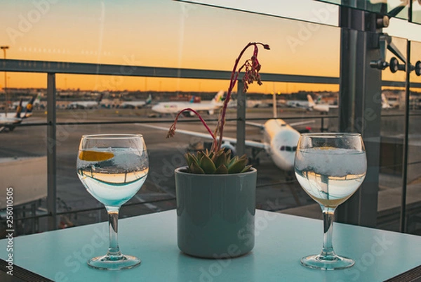 Obraz A refreshing drink at the airport terrace before catching a flight