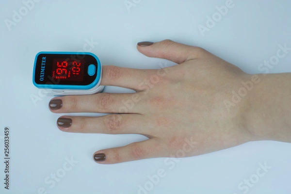 Obraz pulse oximeter hand white  background