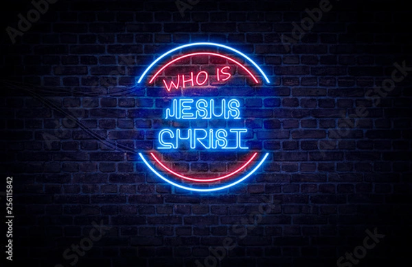 Fototapeta Czerwono-niebieski neon na ścianie z cegły, który brzmi: Kim jest Jezus Chrystus