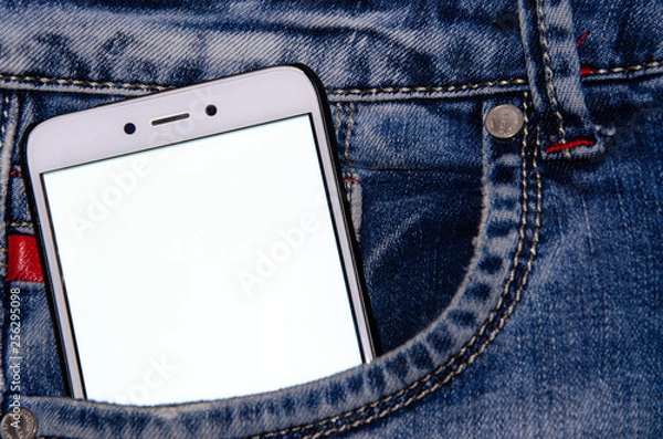 Obraz White smartphone in a white screen jeans pocket
