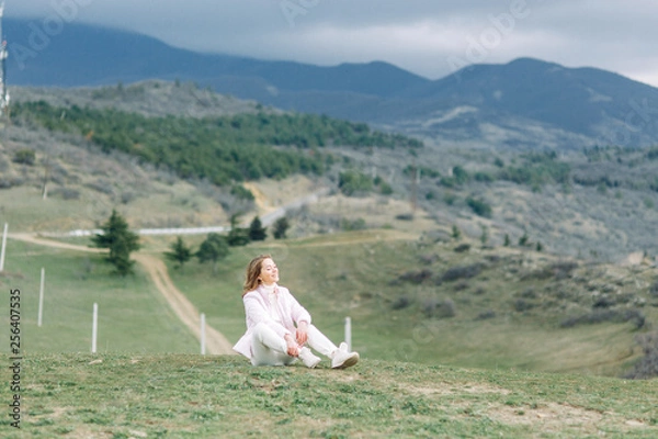 Fototapeta Girl traveler blogger on beautiful views of Georgia. Nature and travel in the mountains.