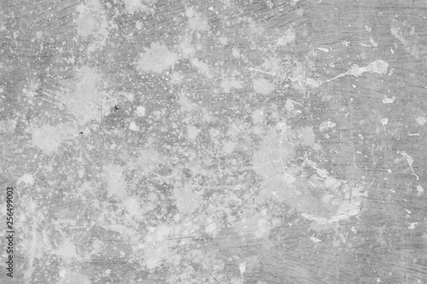 Obraz Black and white photo of old scratched linoleum spattered with white paint. Grunge texture background. Background for design