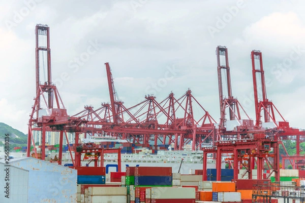 Fototapeta Logistics and transportation of container and crane bridge. import export and transport industry background