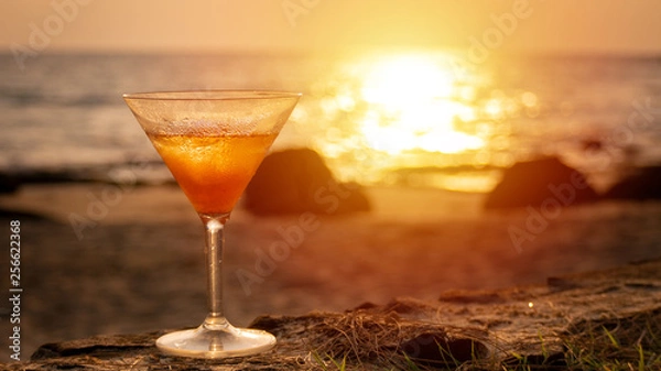 Obraz cocktail glass with sea beach view at background during on sunset time