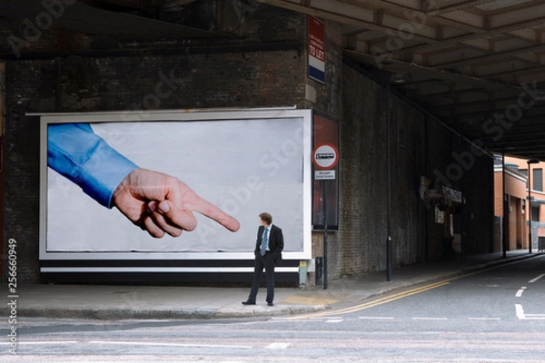 Fototapeta Billboard pointing at businessman