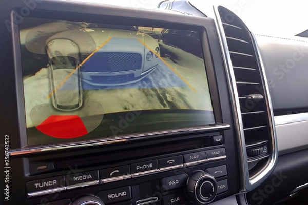 Fototapeta Rearview camera with dynamic trajectory turning lines and parking assistant. Driver assistance systems for parking. View of the monitor.