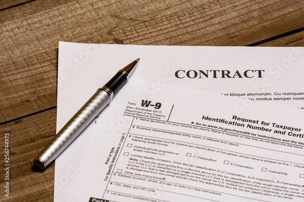 Obraz IRS form W-9 and a contract