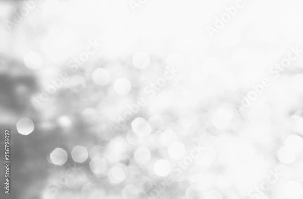 Fototapeta Winter black seasonal bokeh background. Gray bokeh light backgrounds. Silver bubble background. Abstract blurred reflection lighting on gray background.