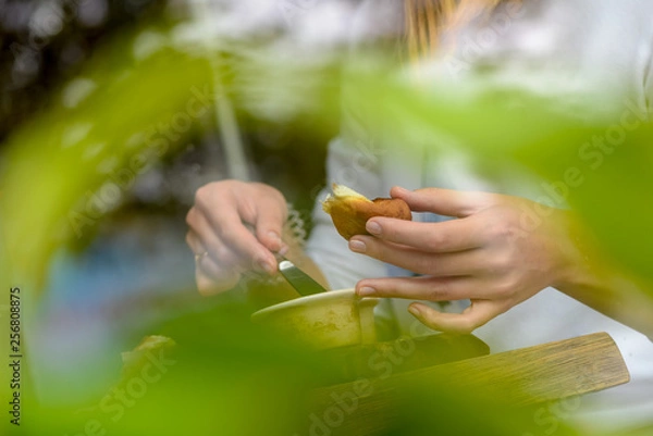 Obraz woman eating fruit outdoors