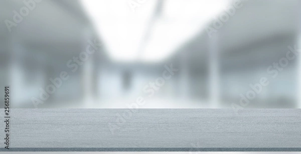 Fototapeta Empty stone table with blurred soft light factory business background. product display template. Mock up template for display. Business presentation.