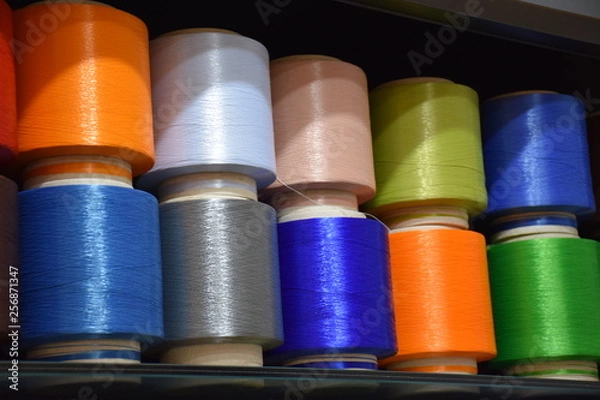 Fototapeta Large colorful polypropylene thread set in rainbow mood. Multicolor bobbin thread. Polypropylene multifilament yarns. Set of sewing thread coils, miscellaneous colours.