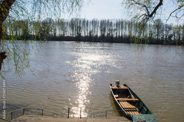 Obraz One Boat On The Riverside in The Spring.