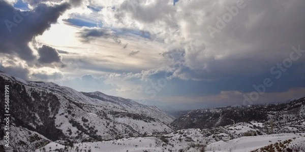 Obraz winter landscape with mountains and clouds