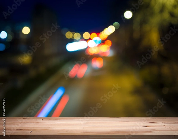 Fototapeta empty table from a light wood with bokeh background