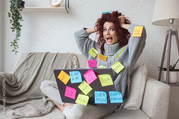 Obraz Very busy lady.Overworked woman with many tasks to do. Female have a lot to do. Business woman stressed.