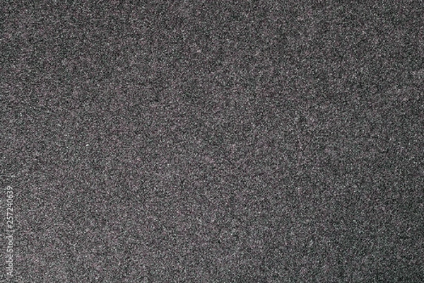 Fototapeta Granular abstract uniform grainy surface.