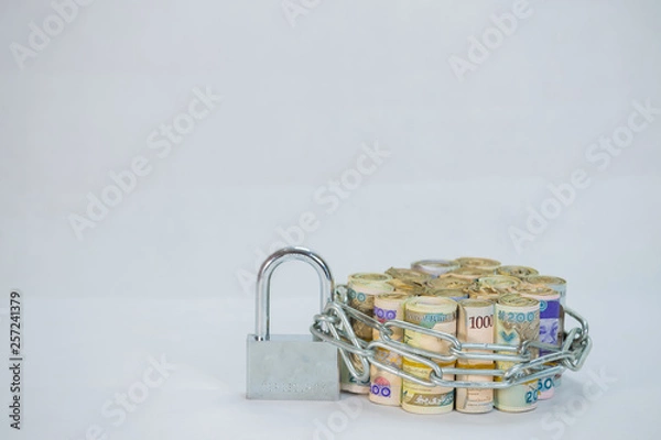 Fototapeta Bundles of naira cash chained and padlock concept of Esecurity