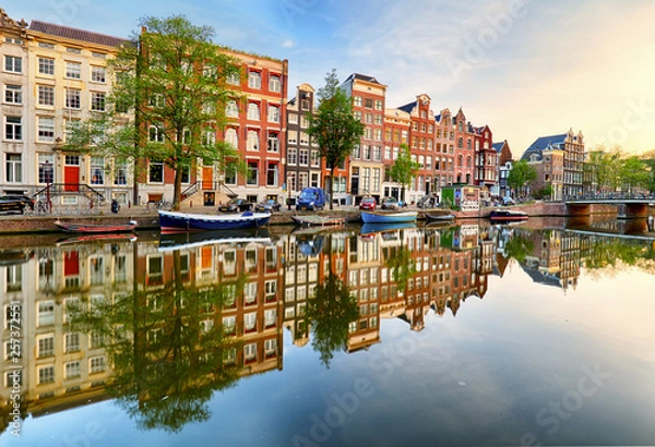 Obraz Beautiful Amsterdam sunset. Typical old dutch houses on the bridge and canals in spring, Netherlands