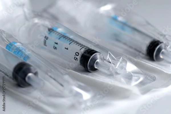 Obraz new medical syringes in sealed packaging ready for use